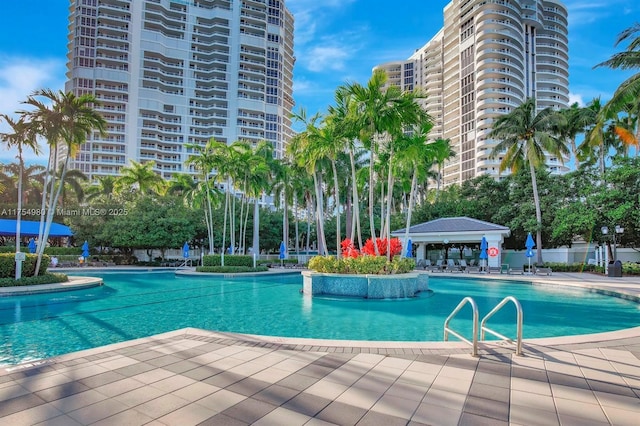 pool featuring a gazebo and a patio