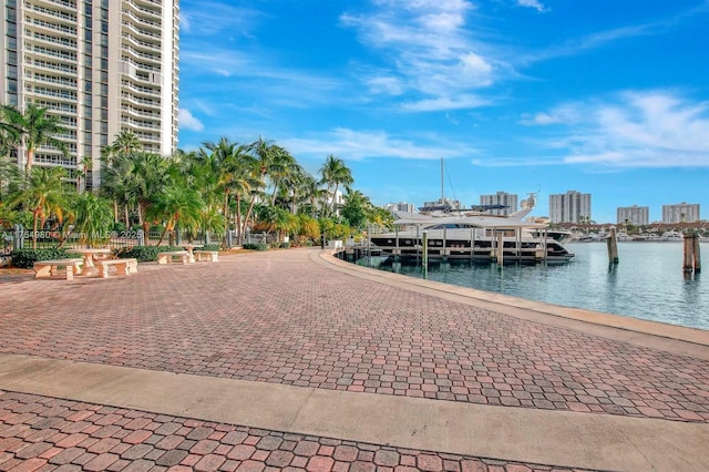 dock area featuring a city view and a water view