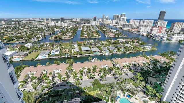 bird's eye view featuring a water view and a view of city