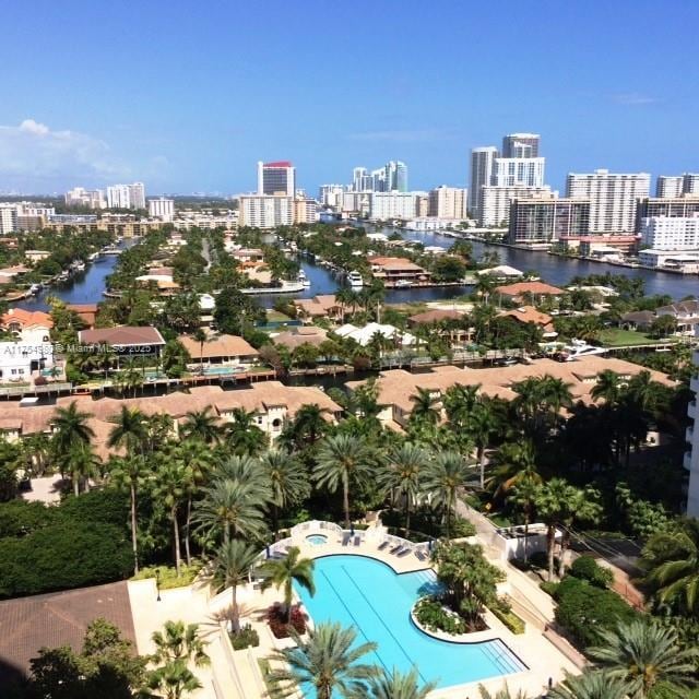 birds eye view of property featuring a view of city and a water view