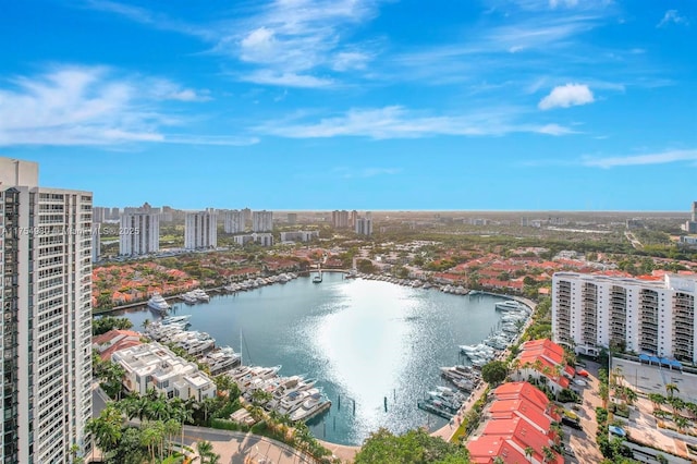 birds eye view of property with a view of city and a water view