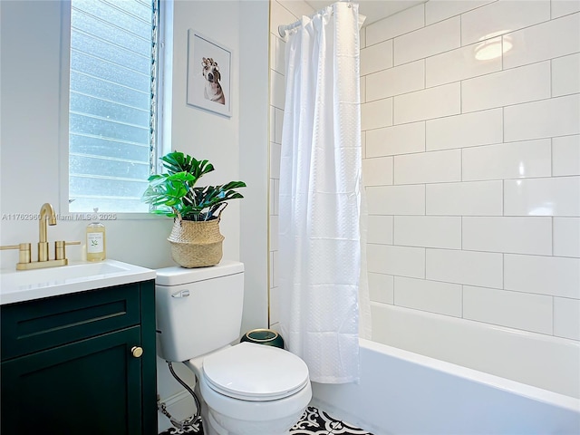 bathroom featuring toilet, vanity, and shower / tub combo