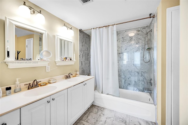 bathroom with shower / bath combination with curtain, marble finish floor, double vanity, and a sink