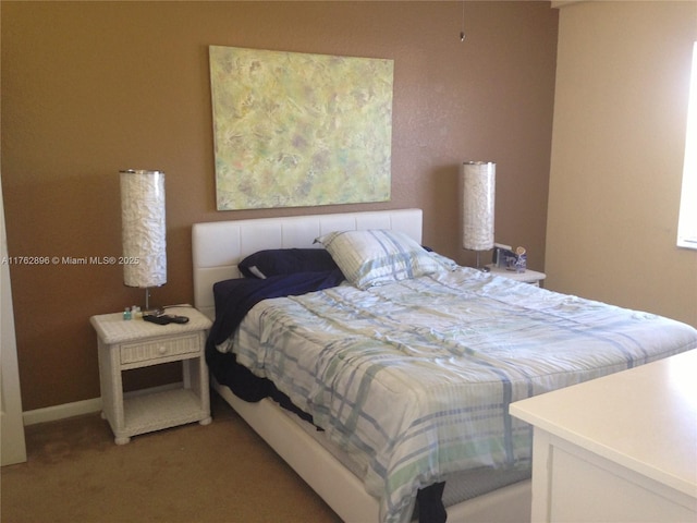 bedroom with light colored carpet