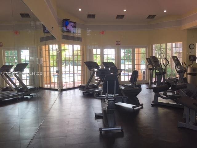 gym with visible vents, recessed lighting, and french doors