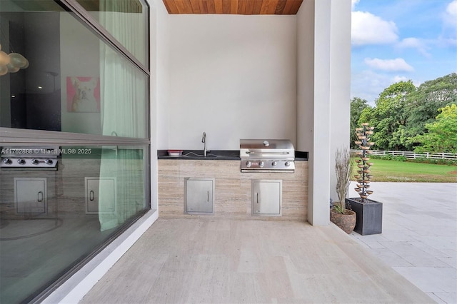 view of patio / terrace featuring grilling area and an outdoor kitchen