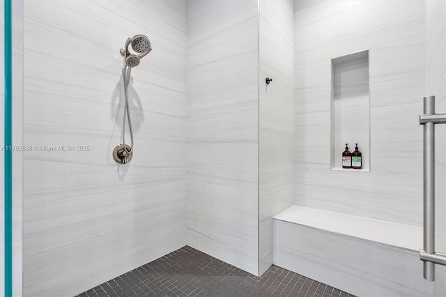 full bathroom with tiled shower