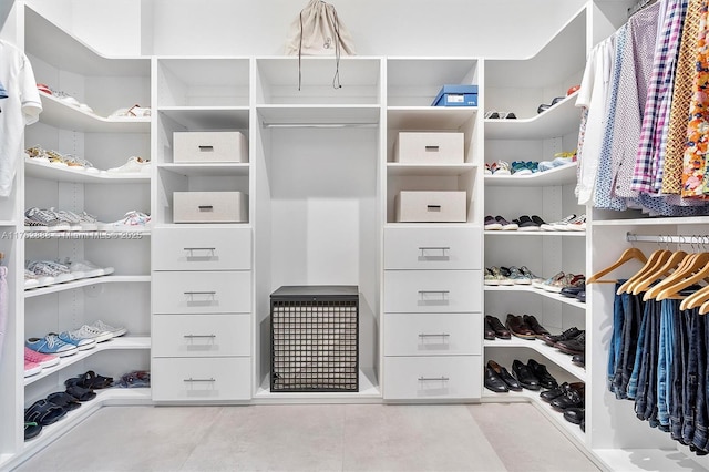 walk in closet with tile patterned floors