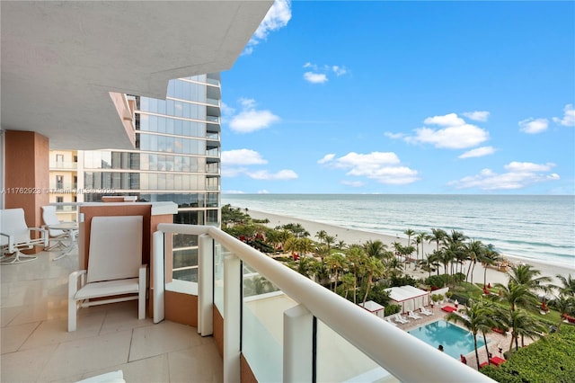 balcony with a beach view and a water view