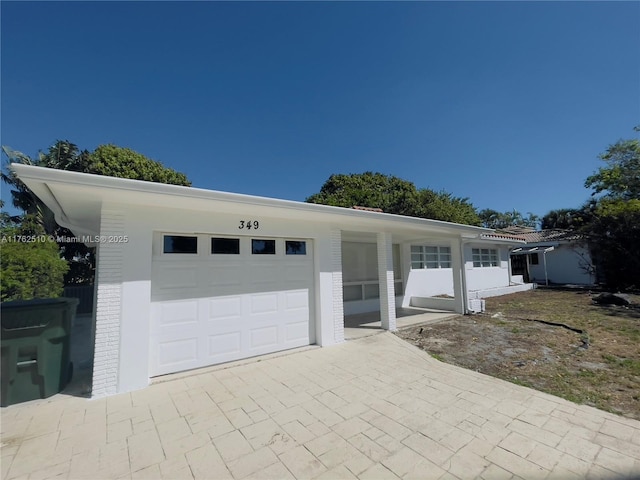 garage featuring driveway