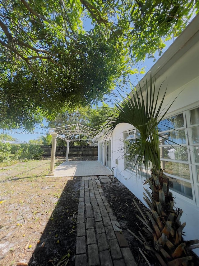 view of patio featuring fence