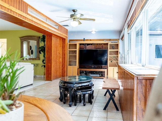 tiled living area featuring visible vents and ceiling fan