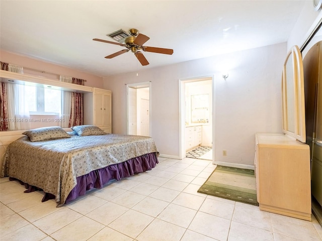 bedroom featuring visible vents, a ceiling fan, connected bathroom, light tile patterned flooring, and baseboards