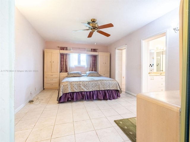 bedroom featuring light tile patterned flooring, baseboards, connected bathroom, and ceiling fan