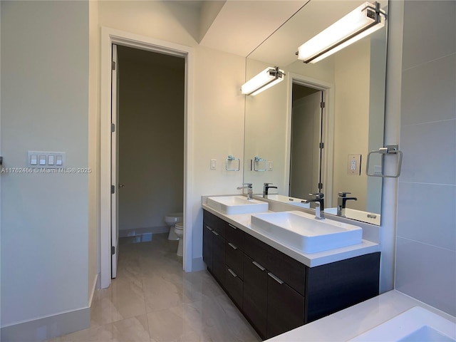 bathroom with toilet and a sink