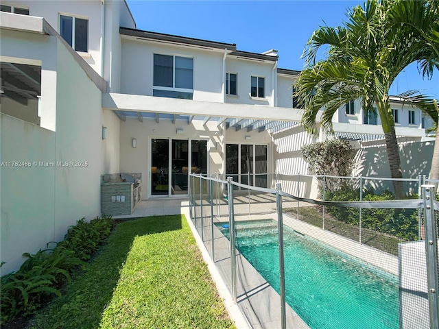 back of house featuring stucco siding, a patio, and fence