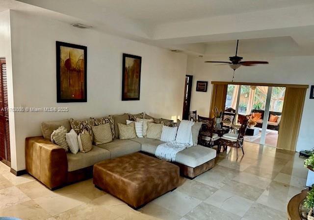 living area featuring ceiling fan