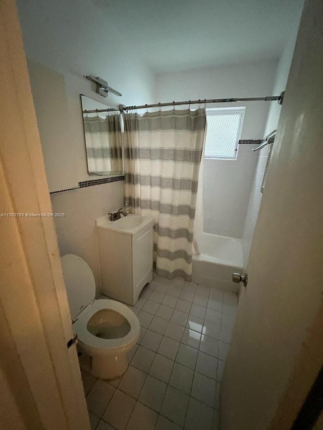 full bath with shower / bathtub combination with curtain, toilet, vanity, and tile patterned flooring