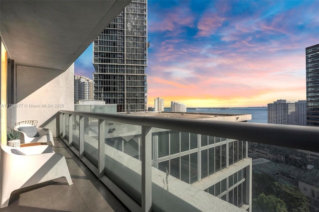 balcony with a city view and a water view