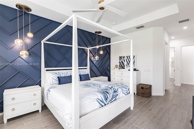 bedroom with visible vents, recessed lighting, baseboards, and wood finish floors