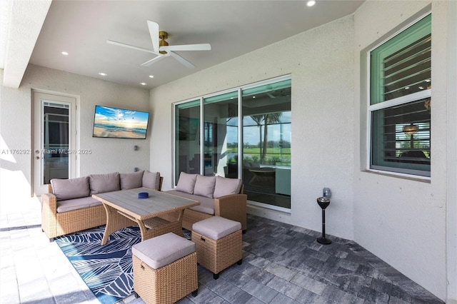 view of patio / terrace featuring a ceiling fan and outdoor lounge area