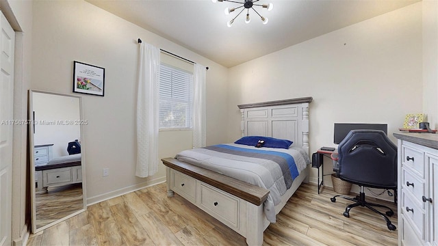 bedroom featuring baseboards and light wood-type flooring