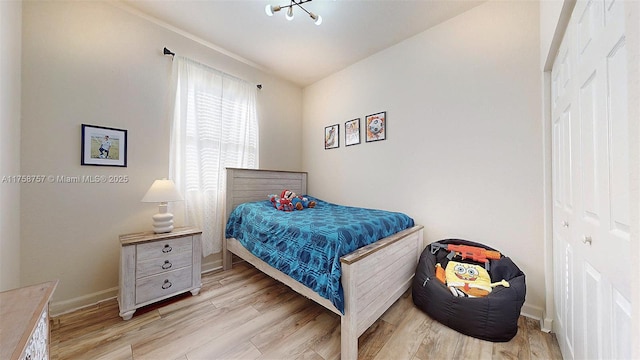 bedroom with baseboards and light wood-style floors