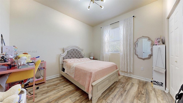 bedroom featuring baseboards and light wood-type flooring