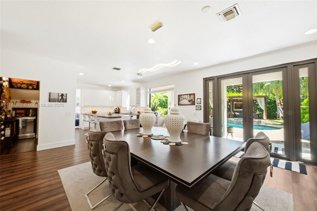 dining space featuring recessed lighting, visible vents, dark wood finished floors, and french doors