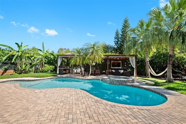 view of pool featuring a gazebo, fence, a pool with connected hot tub, and a patio area