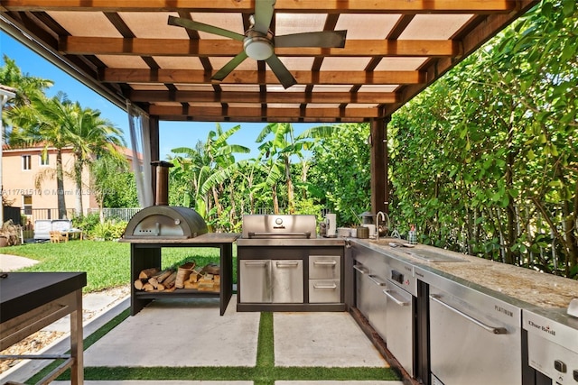 view of patio featuring area for grilling and fence