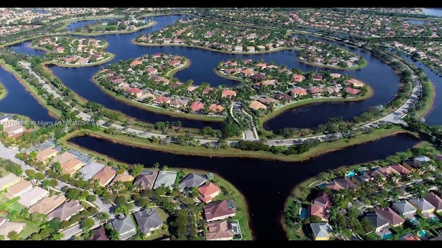 bird's eye view featuring a residential view and a water view