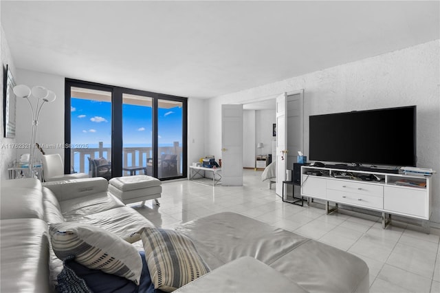 1111 Crandon Blvd Unit B506, Key Biscayne, FL 33149 - living room featuring a wall of windows and light tile patterned floors