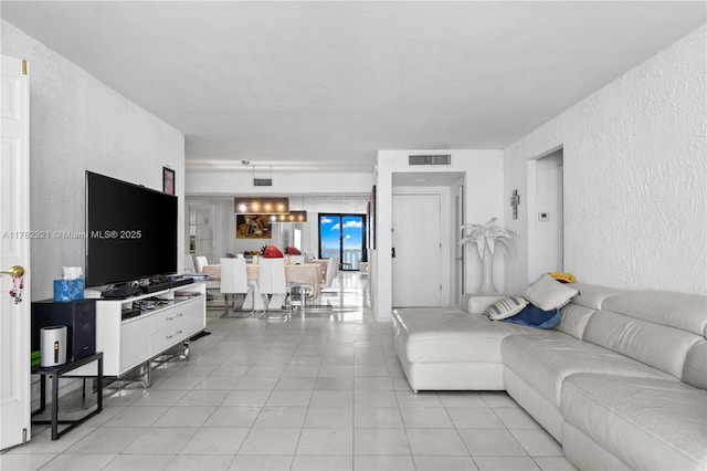1111 Crandon Blvd Unit B506, Key Biscayne, FL 33149 - living room featuring a textured wall and light tile patterned floors