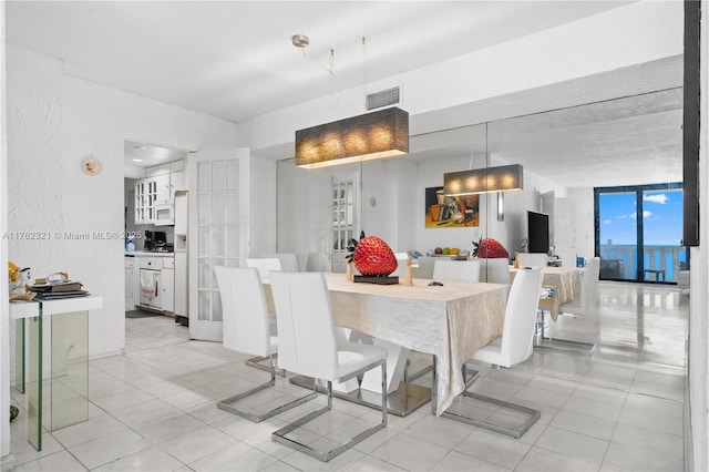 1111 Crandon Blvd Unit B506, Key Biscayne, FL 33149 - dining area with light tile patterned flooring