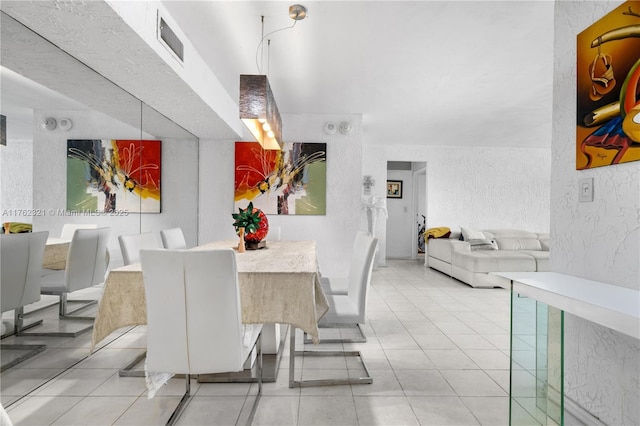 1111 Crandon Blvd Unit B506, Key Biscayne, FL 33149 - dining space featuring a textured wall and light tile patterned floors