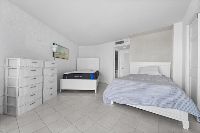 1111 Crandon Blvd Unit B506, Key Biscayne, FL 33149 - bedroom featuring light tile patterned flooring and a textured wall