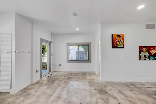 entrance foyer with recessed lighting, visible vents, baseboards, and concrete floors