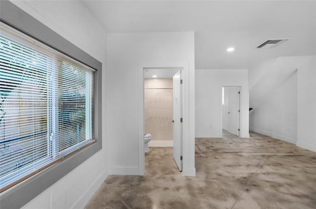 bathroom with visible vents, baseboards, recessed lighting, concrete flooring, and toilet