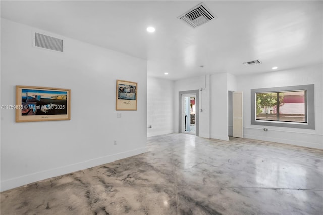 unfurnished room with recessed lighting, visible vents, and concrete floors