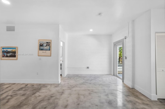 interior space with visible vents, recessed lighting, finished concrete flooring, and baseboards