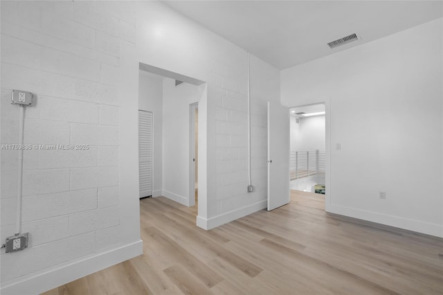 interior space with visible vents, baseboards, and light wood-style floors