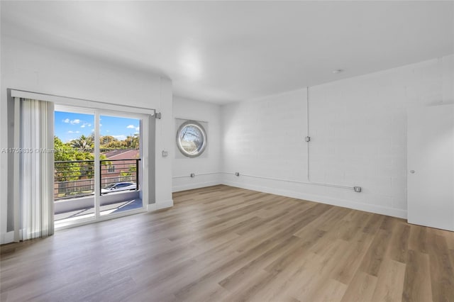 interior space with wood finished floors and baseboards