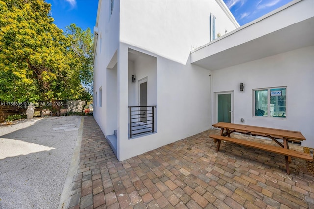 view of patio / terrace featuring fence