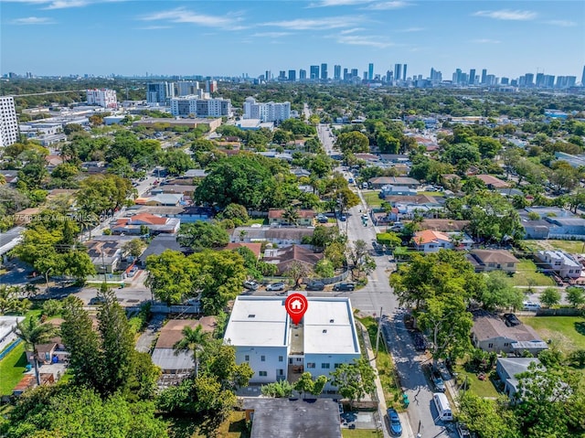 birds eye view of property featuring a city view