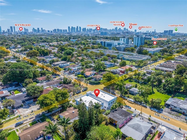 birds eye view of property featuring a city view