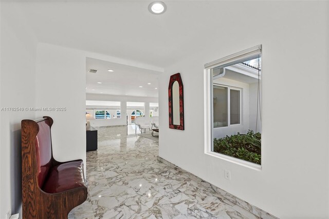 1690 Daytonia Rd, Miami Beach, FL 33141 - corridor with marble tiled flooring and recessed lighting