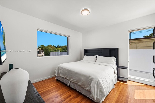 1690 Daytonia Rd, Miami Beach, FL 33141 - bedroom with baseboards and light wood-style flooring