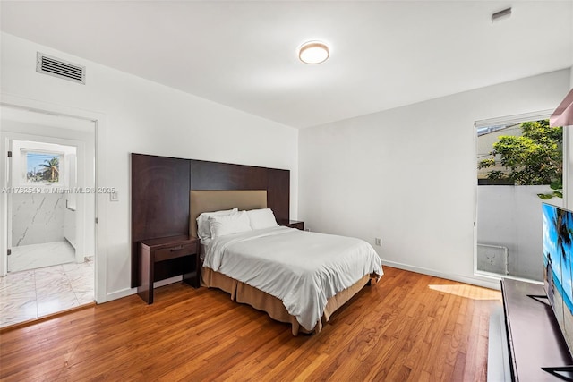 1690 Daytonia Rd, Miami Beach, FL 33141 - bedroom featuring light wood-style floors and baseboards