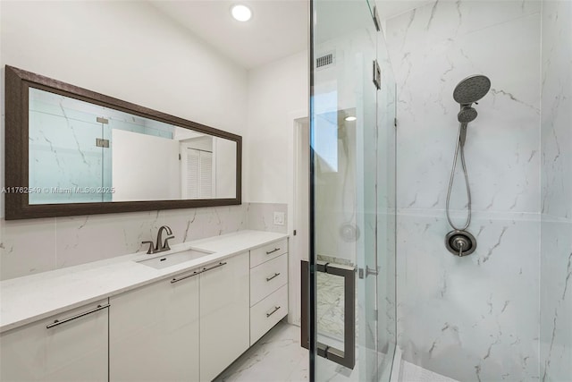 1690 Daytonia Rd, Miami Beach, FL 33141 - bathroom with a marble finish shower, marble finish flooring, and vanity